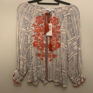 T H M L tassel tie embroidered top